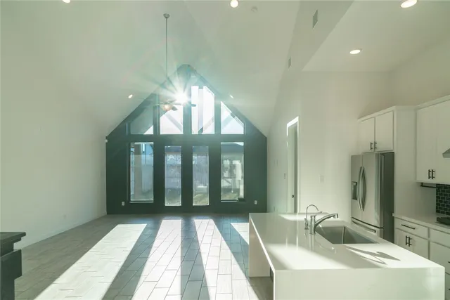 a bathroom with a sink a large mirror and a shower