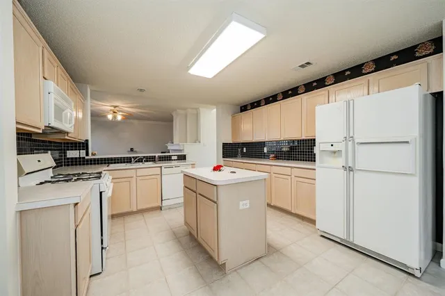 a view of an empty room with a fireplace