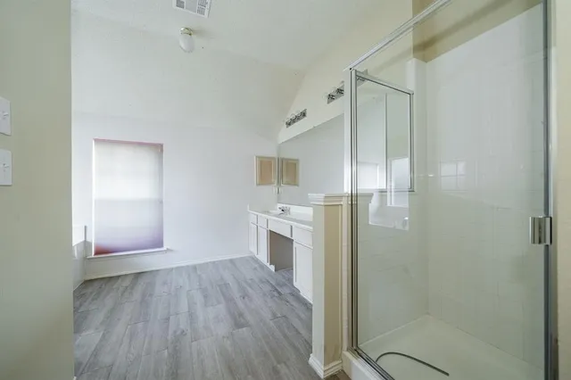 a view of a kitchen with sink cabinets and wooden floor