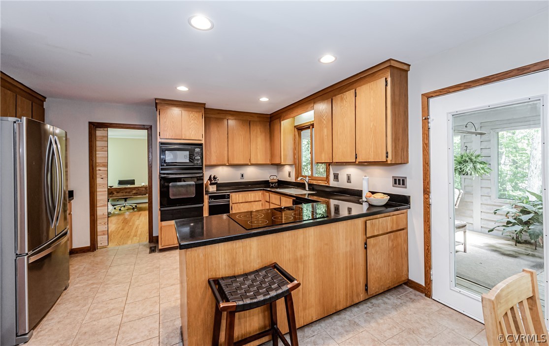 6022 Watch Harbour Road Midlothian, VA 23112 - Photo 3 of 50 a kitchen with stainless steel appliances granite countertop a refrigerator a sink and a stove