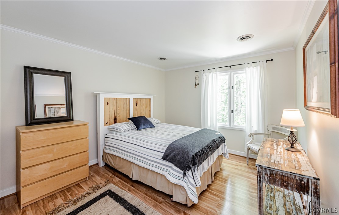 6022 Watch Harbour Road Midlothian, VA 23112 - Photo 38 of 50 a bedroom with a bed and wooden floor