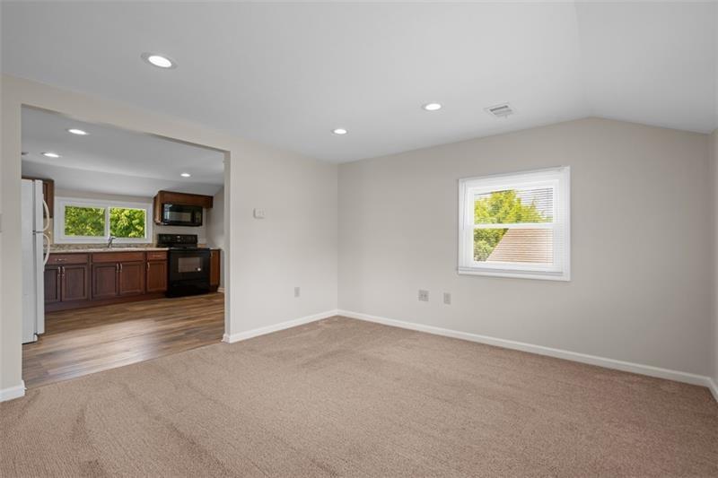 1122 Pittsburgh Road Valencia, PA 16059 - Photo 14 of 25 an empty room with kitchen and windows