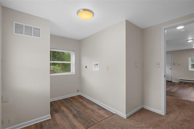 1122 Pittsburgh Road Valencia, PA 16059 - Photo 21 of 25 an empty room with wooden floor and windows