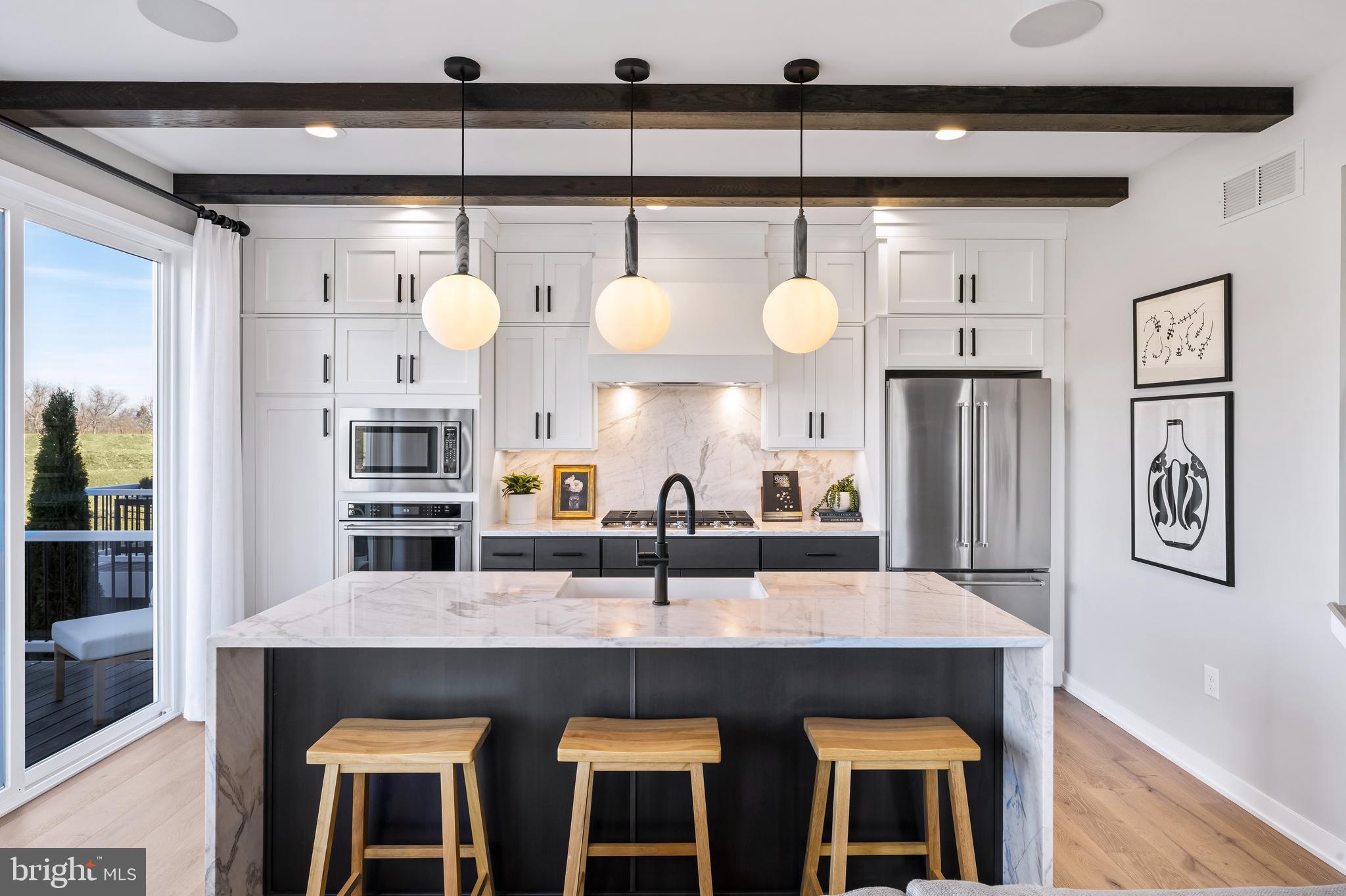 a kitchen with cabinets and window