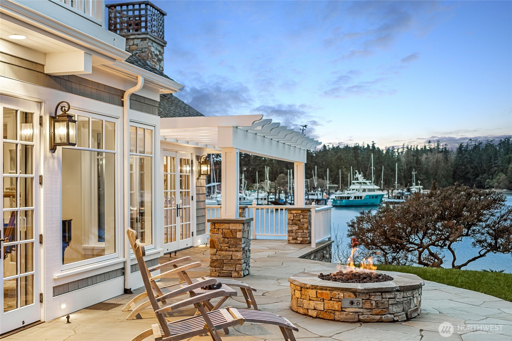 95 Laurel Point Lane Friday Harbor, WA 98250 - Photo 14 of 40 a view of a patio with couches table and chairs and potted plants