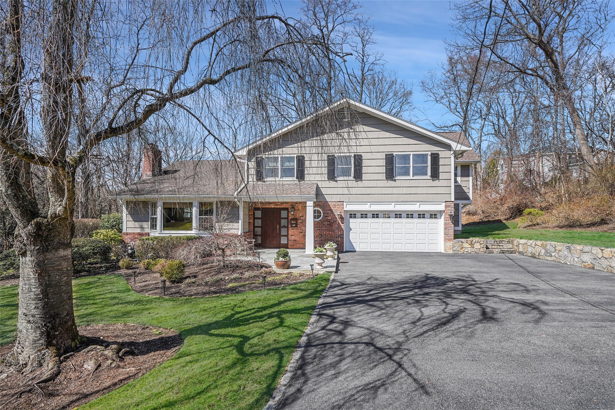 33 Meadowlark Road Rye Brook, NY 10573 - Photo 1 of 1 a front view of a house with a yard