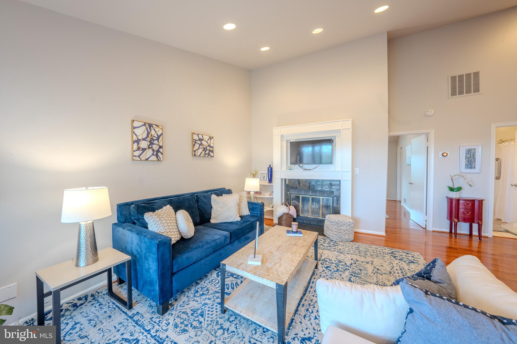 11168 Beaver Trail Court Reston, VA 20191 - Photo 12 of 42 a living room with furniture and a lamp