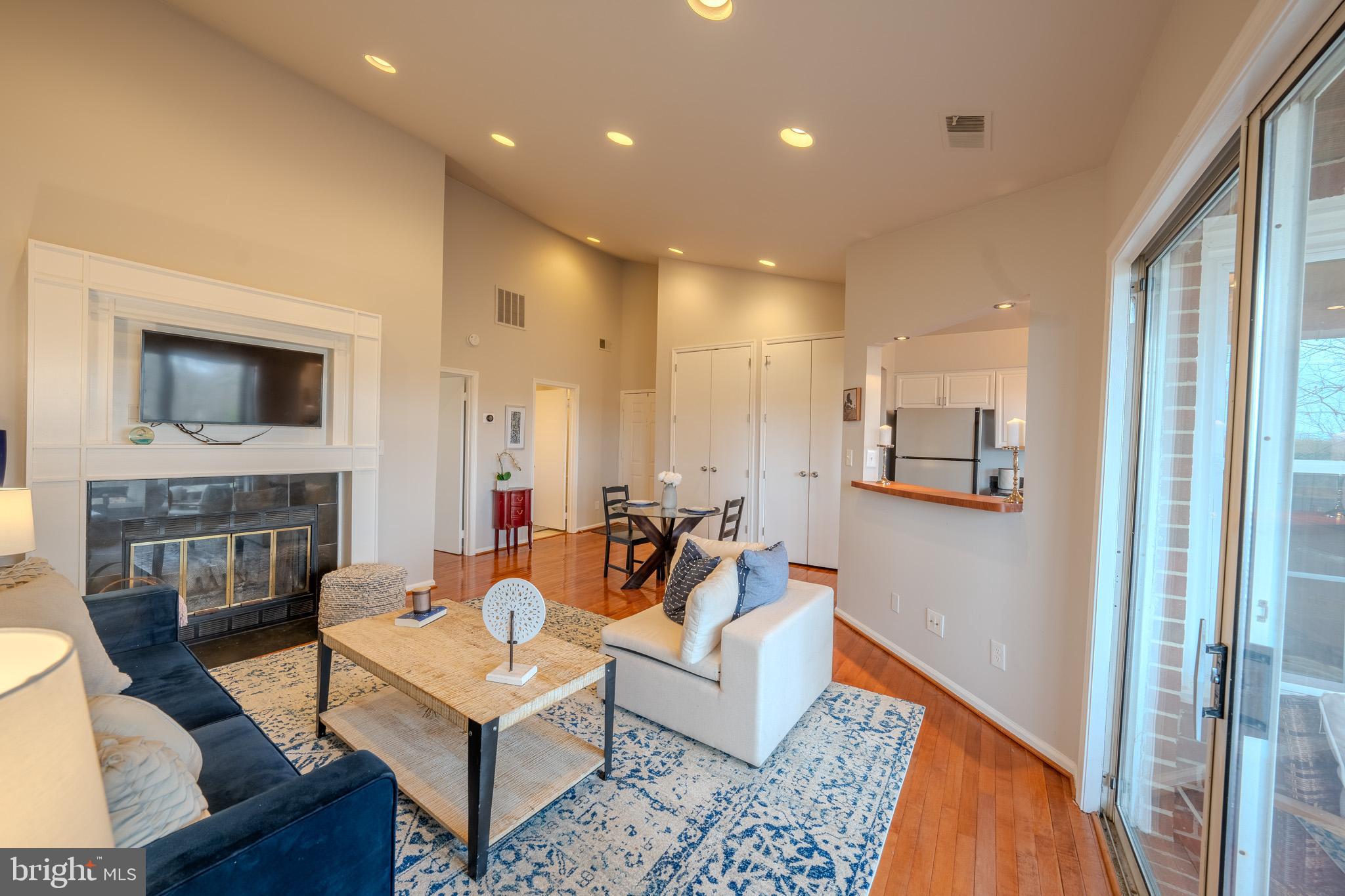 11168 Beaver Trail Court Reston, VA 20191 - Photo 14 of 42 a living room with fireplace furniture and a flat screen tv