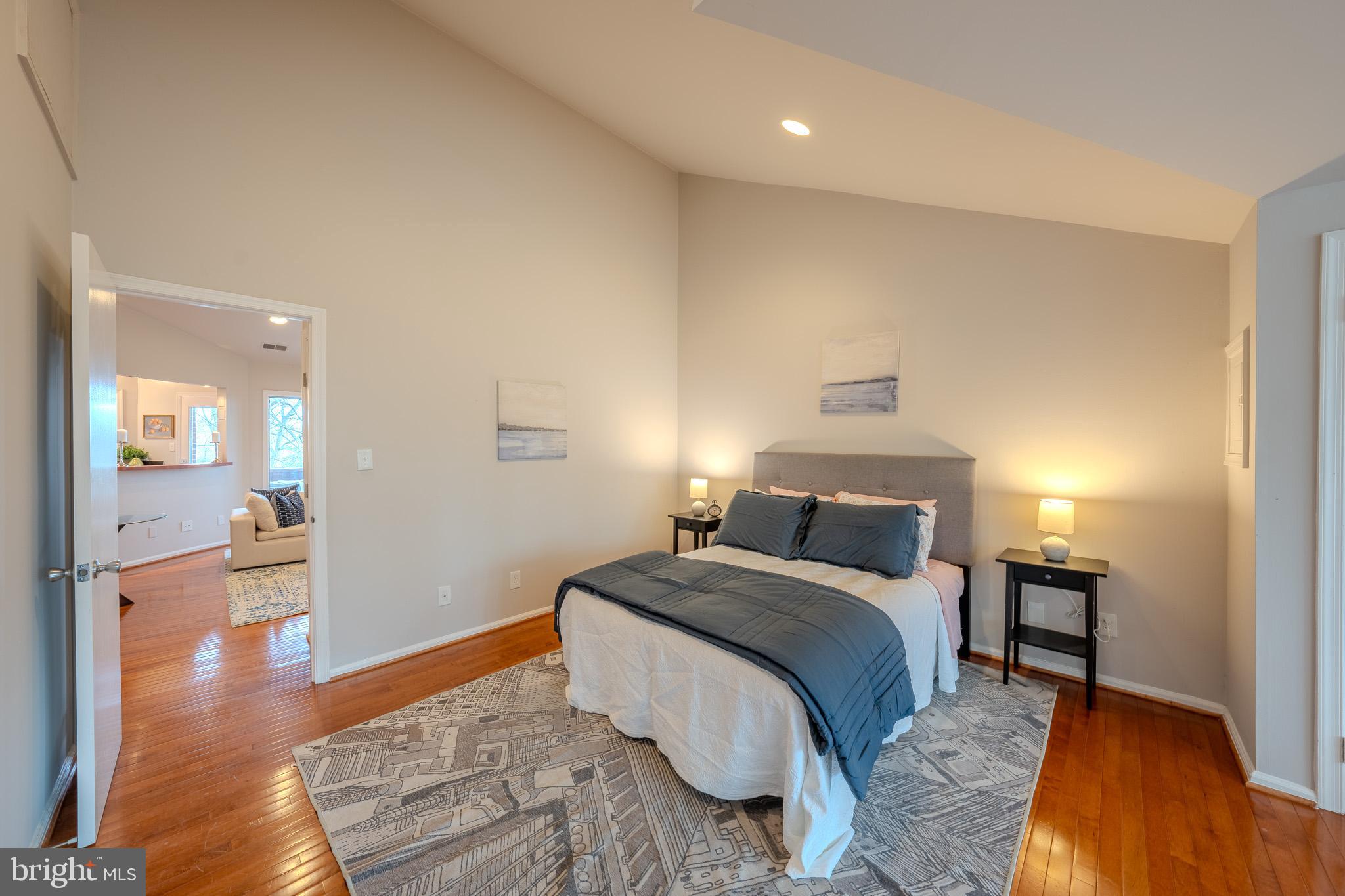 11168 Beaver Trail Court Reston, VA 20191 - Photo 24 of 42 a bedroom with a bed and wooden floor