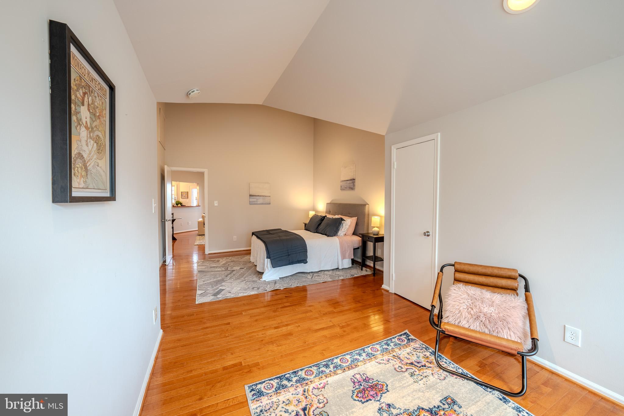 11168 Beaver Trail Court Reston, VA 20191 - Photo 25 of 42 a bedroom with a bed and wooden floor