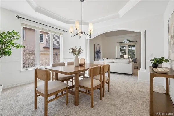 a dining room with furniture and window