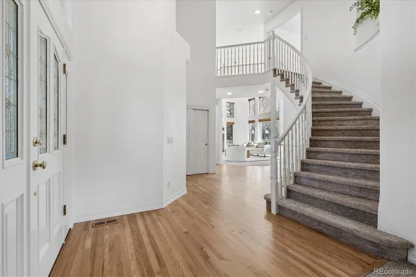 a view of entryway with wooden floor