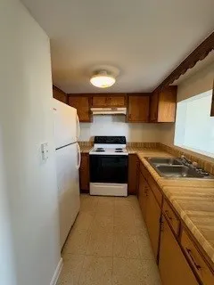 a kitchen with a stove and a refrigerator