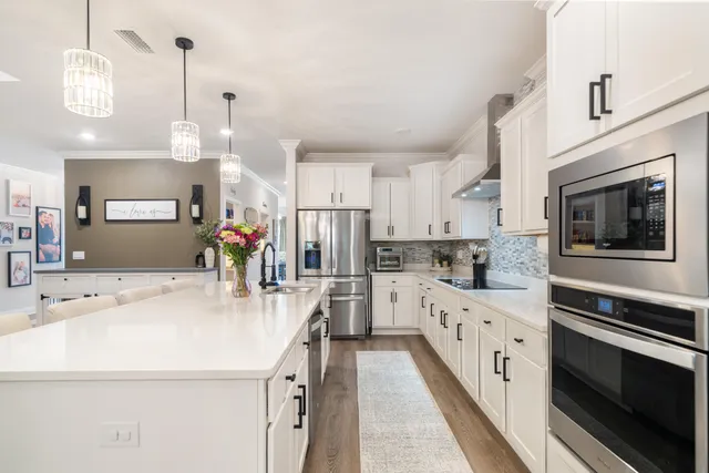 a bathroom with a double vanity sink mirror and shower