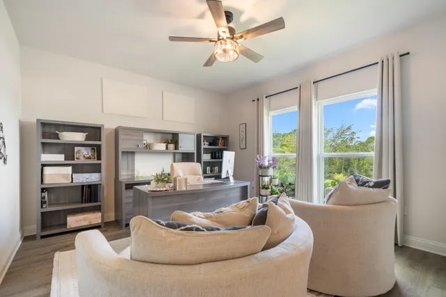 a dining room with furniture and window