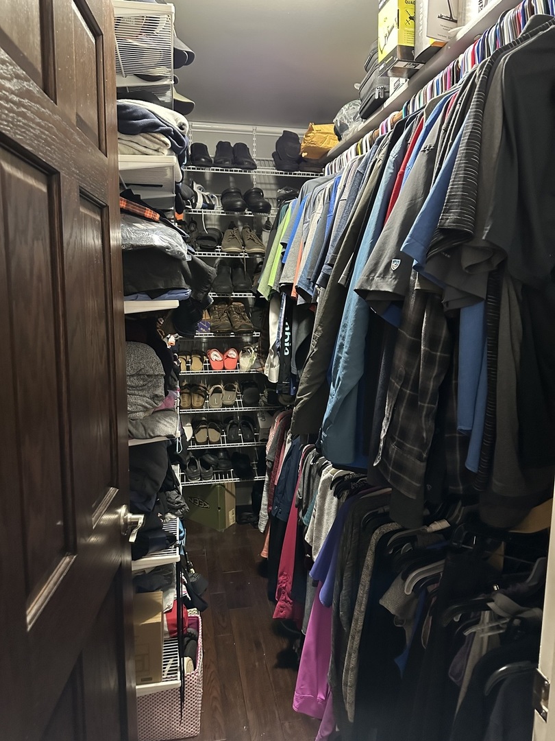 302 North Westgate Road Mount Prospect, IL 60056 - Photo 13 of 26 a view of walk in closet with clothes and shoes