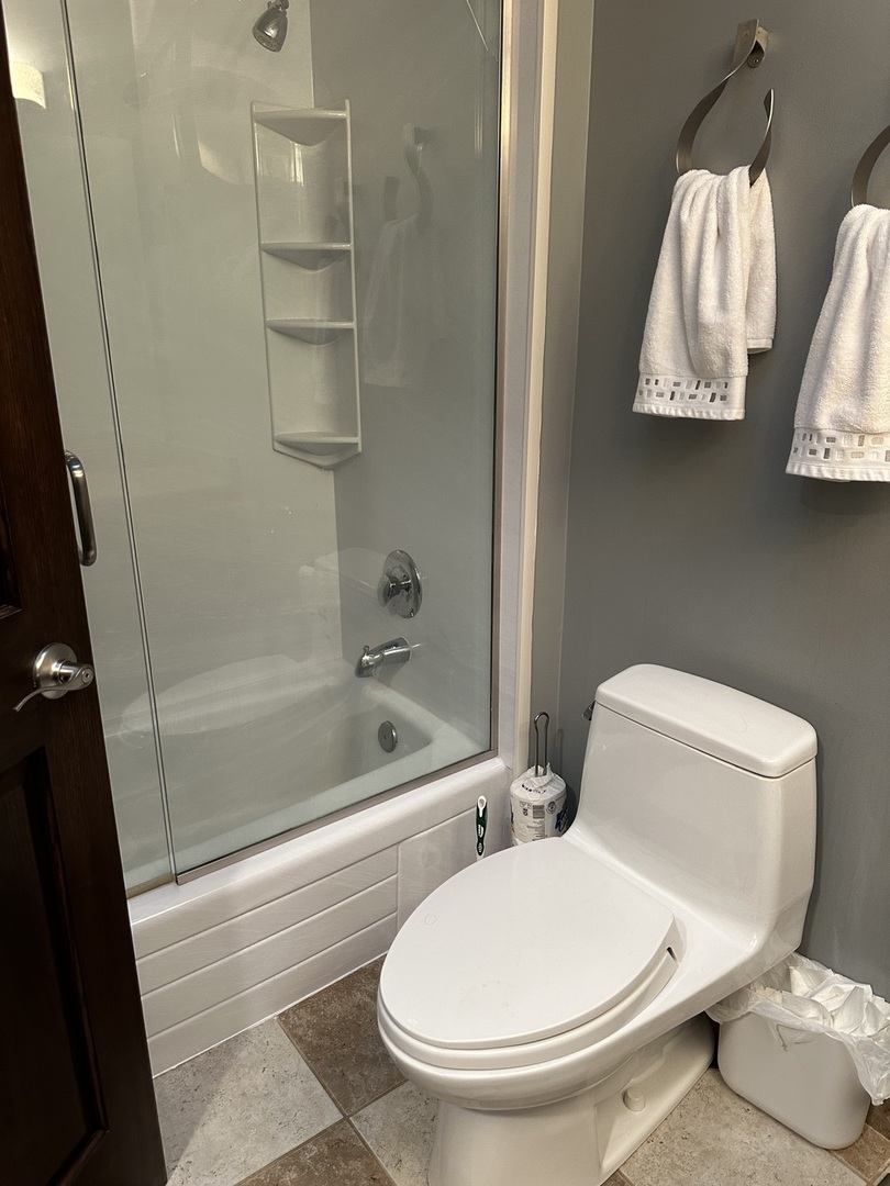 302 North Westgate Road Mount Prospect, IL 60056 - Photo 15 of 26 a white toilet sitting next to a bath tub and shower