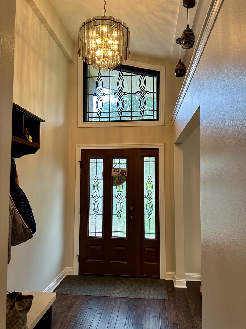 302 North Westgate Road Mount Prospect, IL 60056 - Photo 2 of 26 a view of hall way with wooden floor and chandelier
