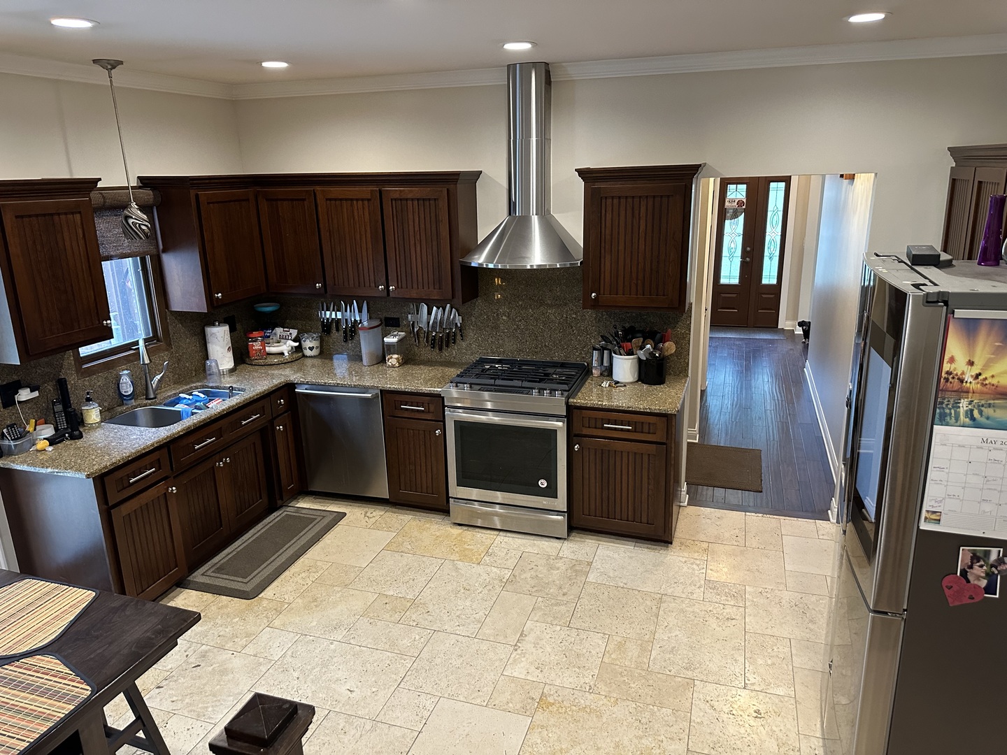 302 North Westgate Road Mount Prospect, IL 60056 - Photo 4 of 26 a kitchen with stainless steel appliances granite countertop a stove top oven a sink dishwasher and a refrigerator