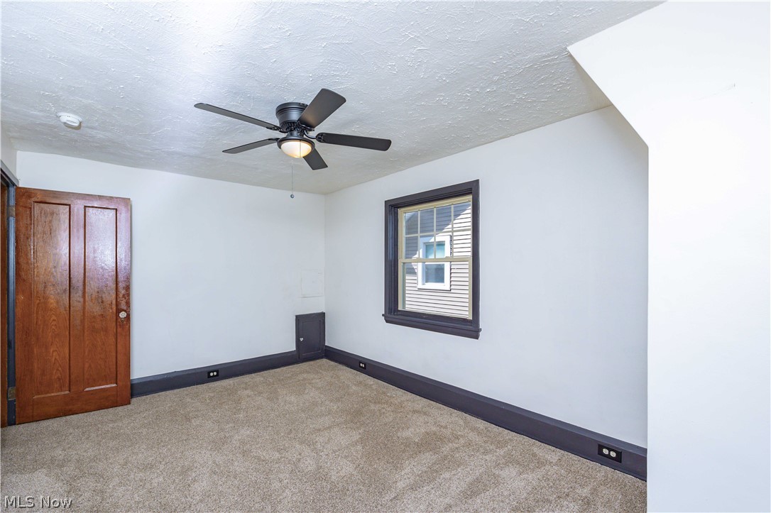 3254 Redwood Road Cleveland Heights, OH 44118 - Photo 39 of 49 Carpeted spare room with ceiling fan and a textured ceiling