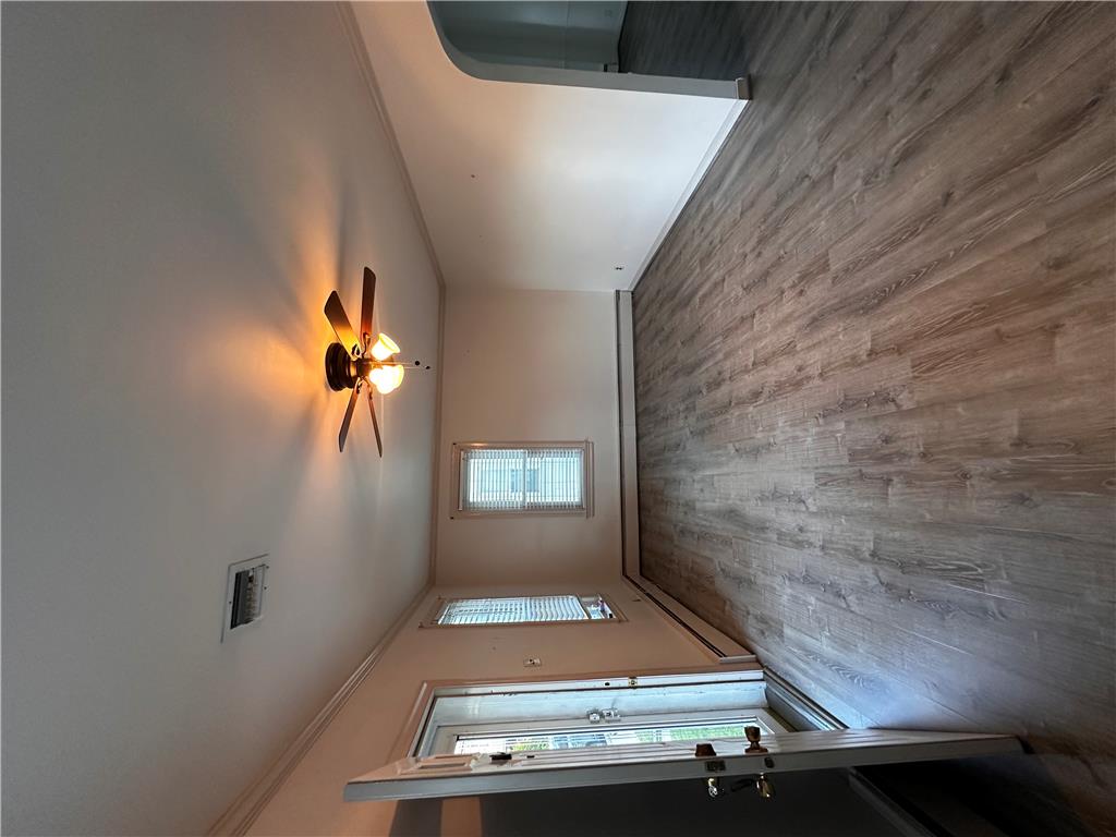5128 3rd Street Whitehall, PA 18052 - Photo 11 of 26 Wood-look flooring and a functional ceiling fan combine in this inviting room.