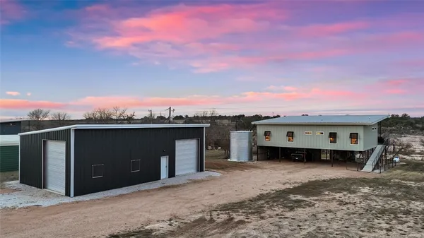 a view of a car in front of a house