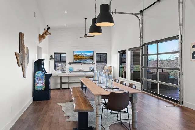 a kitchen with a sink cabinets and wooden floor