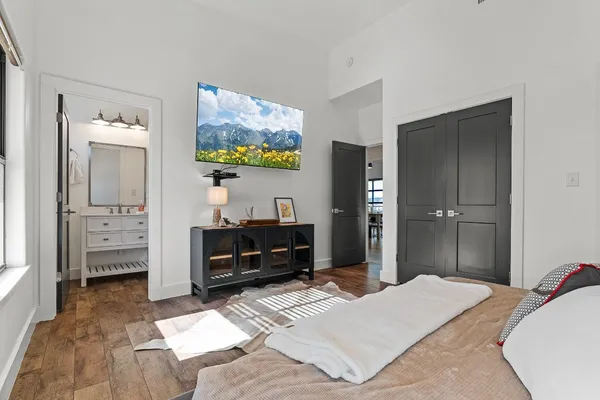 a bedroom with a bed and a couch