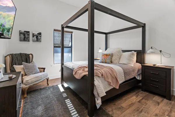 a bedroom with a bed and a couch