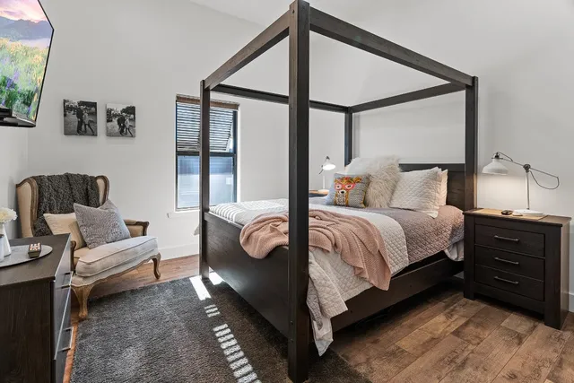 a bedroom with a bed and a couch