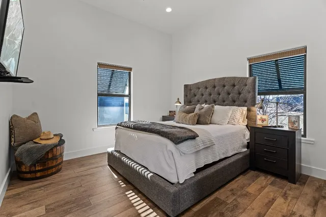 a bathroom with a double vanity sink a mirror and shower