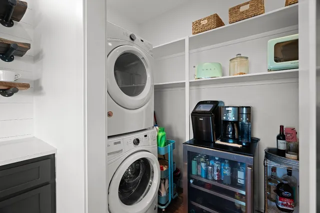 a view of a balcony with wooden floor and fence