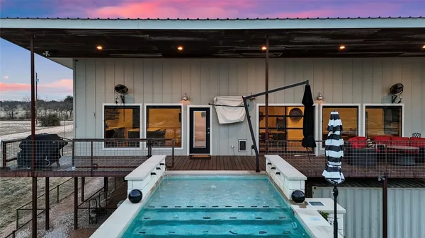 a view of a terrace with a table and chairs