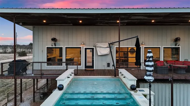 a view of a terrace with a table and chairs
