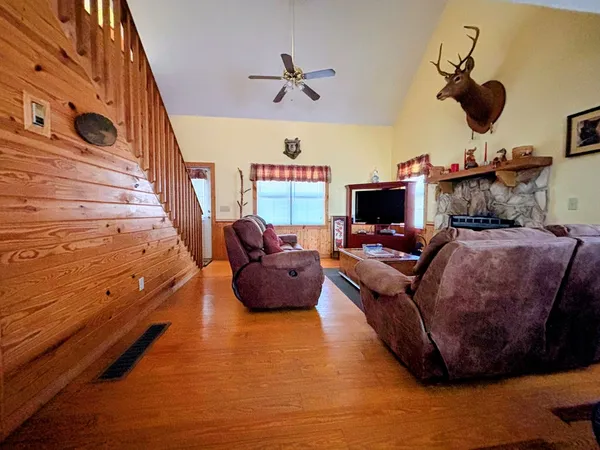 a living room with furniture and a flat screen tv