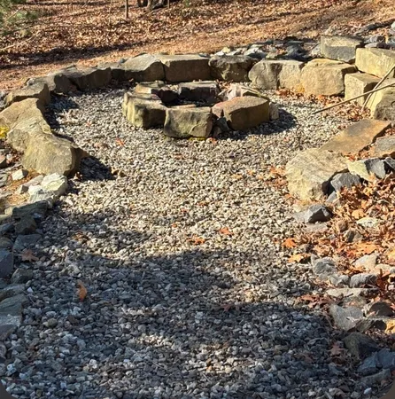 a view of a backyard of the house