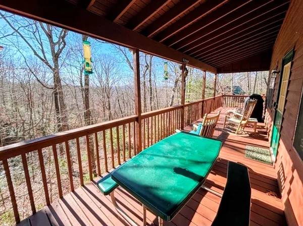 a view of a chairs in backyard of the house