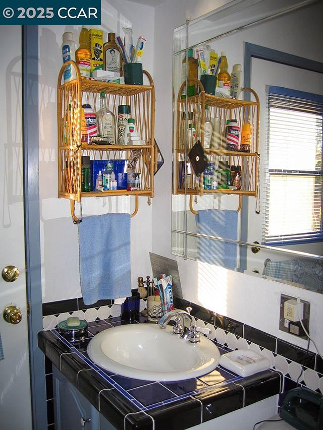 362 Summit Court Pinole, CA 94564 - Photo 27 of 57 a bathroom with a sink and a window