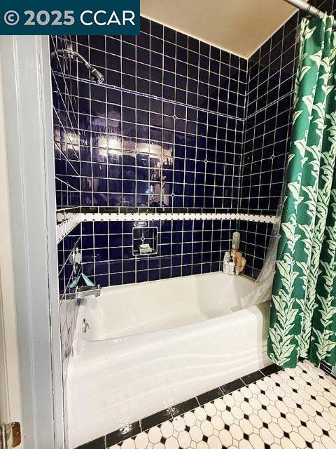 362 Summit Court Pinole, CA 94564 - Photo 28 of 57 a bathroom with a bathtub and shower