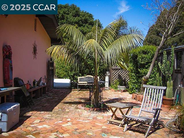 362 Summit Court Pinole, CA 94564 - Photo 38 of 57 a view of a patio with a table and chairs
