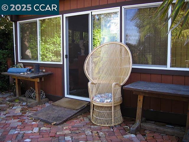362 Summit Court Pinole, CA 94564 - Photo 39 of 57 a table with chairs and a table in front of a window