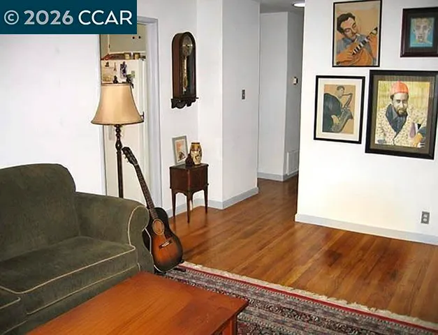 a view of backyard with wheel chair potted plants and wooden floor