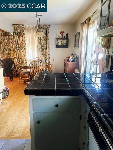 362 Summit Court Pinole, CA 94564 - Photo 10 of 57 a kitchen with a stove and a table