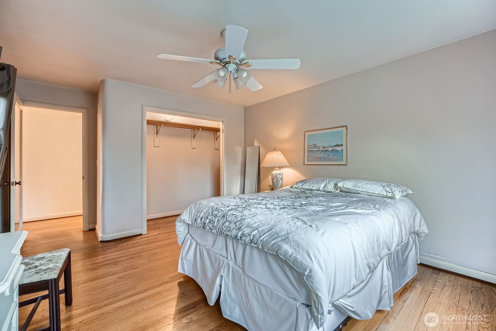 3041 52nd Avenue Southwest Seattle, WA 98116 - Photo 13 of 31 a bedroom with a bed and wooden floor
