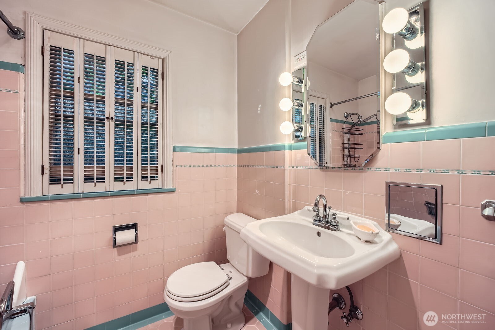 3041 52nd Avenue Southwest Seattle, WA 98116 - Photo 15 of 31 a bathroom with a sink toilet and mirror