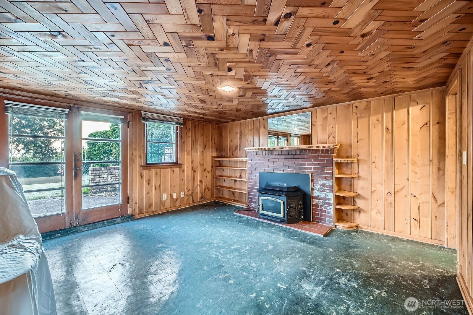 3041 52nd Avenue Southwest Seattle, WA 98116 - Photo 20 of 31 a view of an empty room with a fireplace and a window