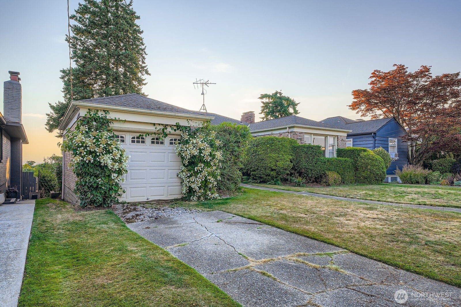 3041 52nd Avenue Southwest Seattle, WA 98116 - Photo 2 of 31 a front view of a house with a yard