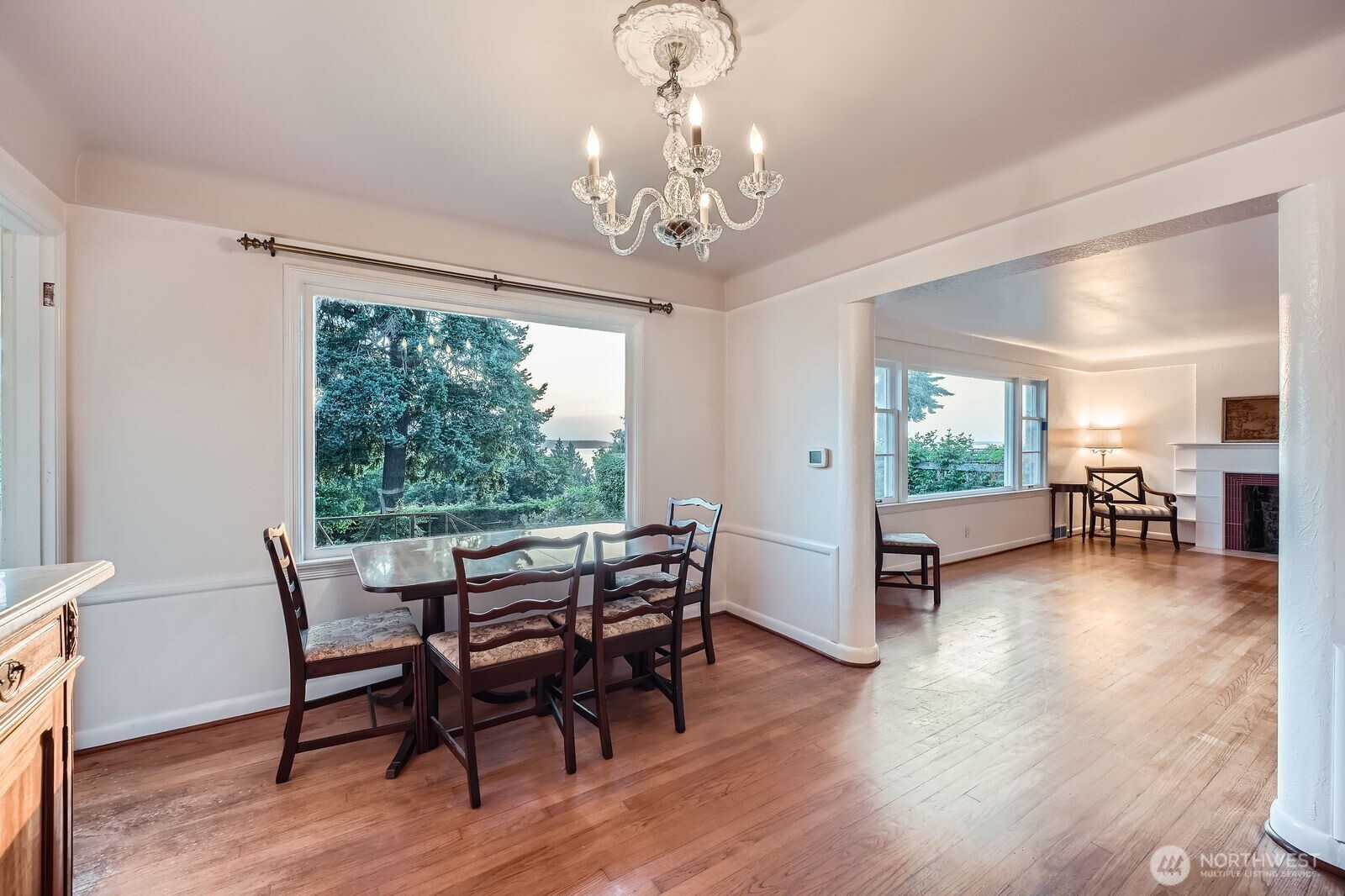 3041 52nd Avenue Southwest Seattle, WA 98116 - Photo 24 of 31 a view of a dining room with furniture window and wooden floor