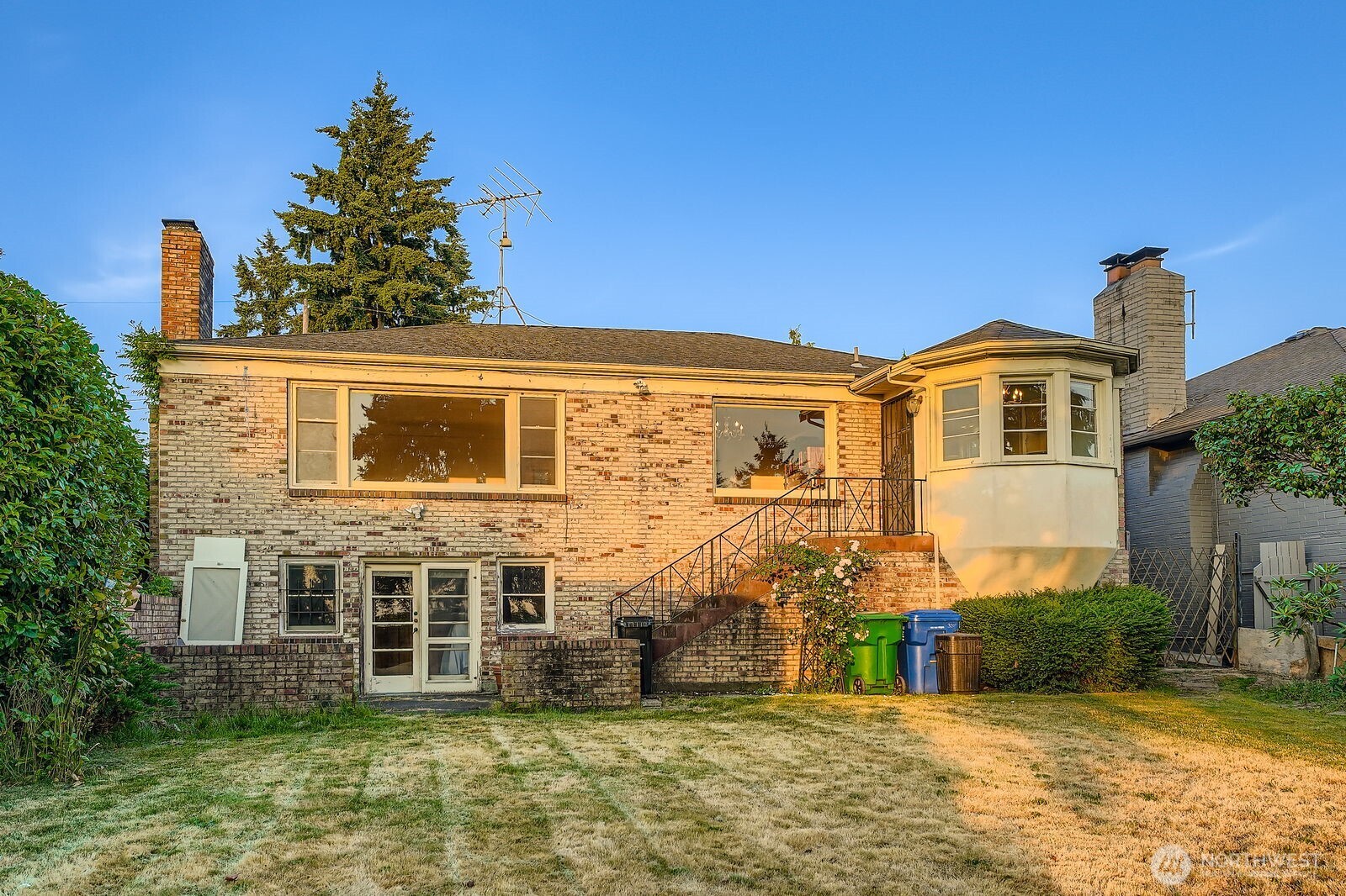 3041 52nd Avenue Southwest Seattle, WA 98116 - Photo 27 of 31 a front view of a house with a yard