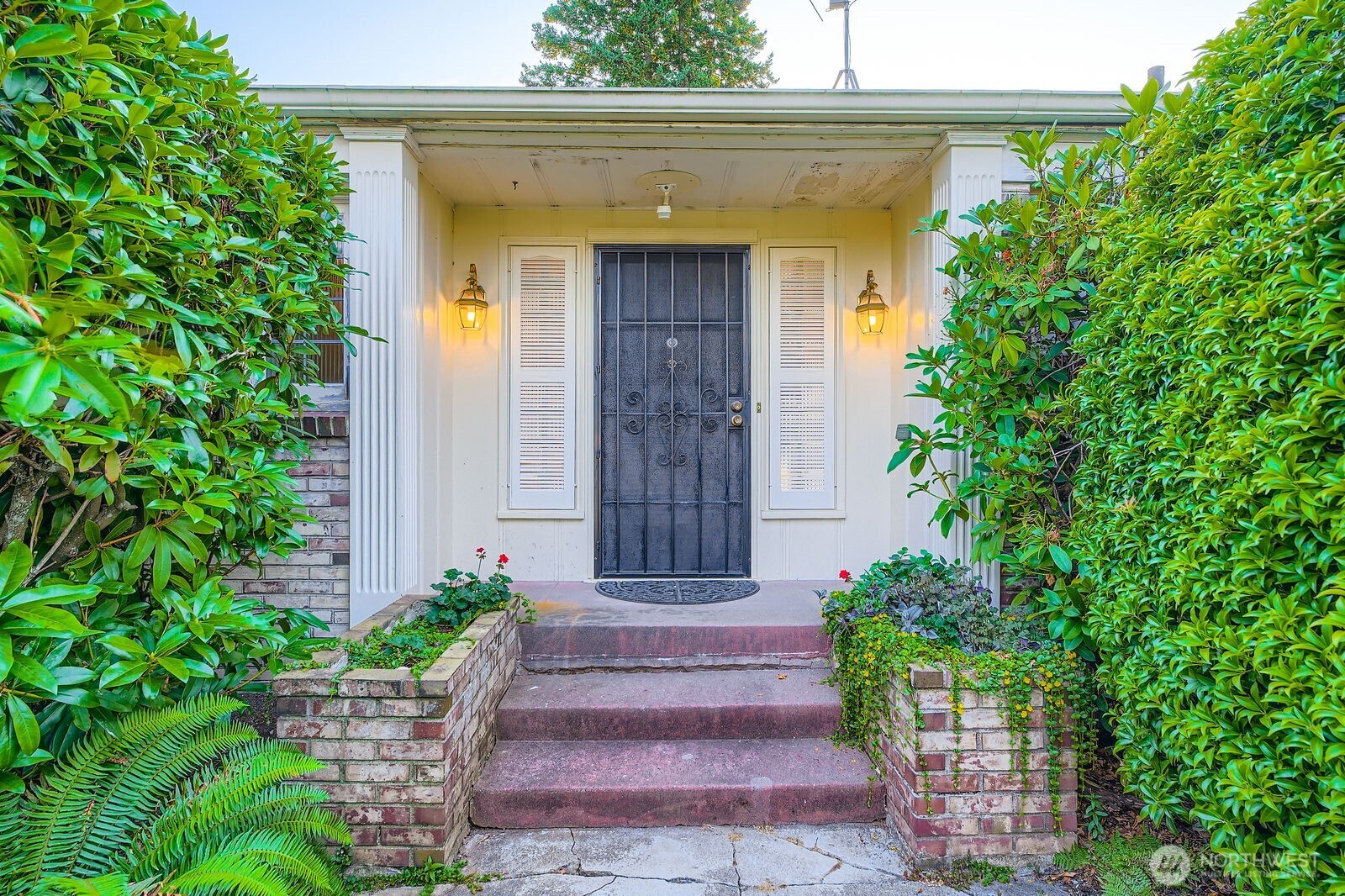 3041 52nd Avenue Southwest Seattle, WA 98116 - Photo 3 of 31 a front view of a house with plants